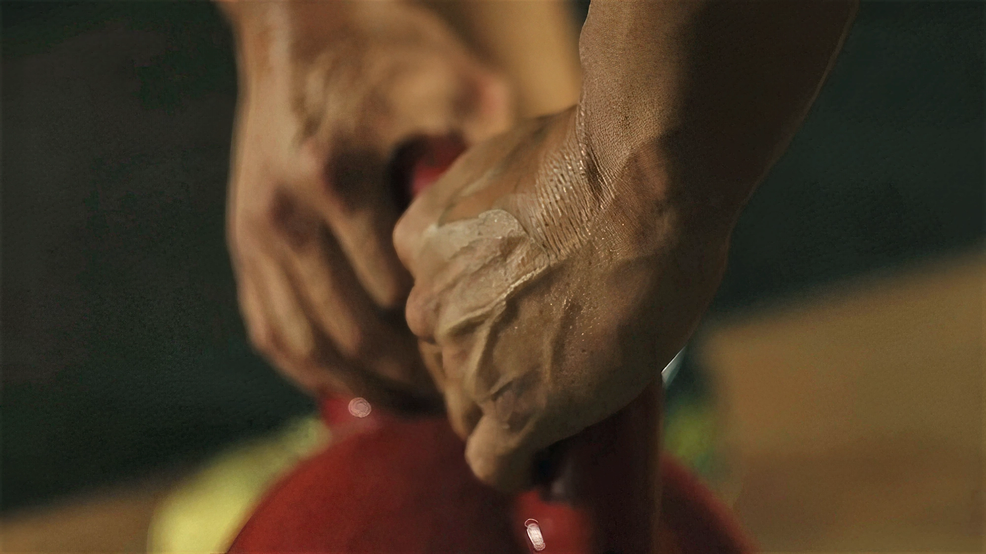 Close-up video frame of a hand gripping a kettlebell from a Goat Training commercial produced by Memento Agency – promotional fitness footage